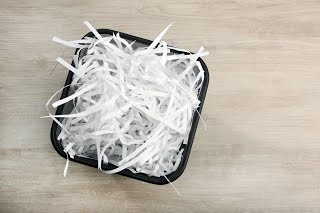 Bin of paper shreds